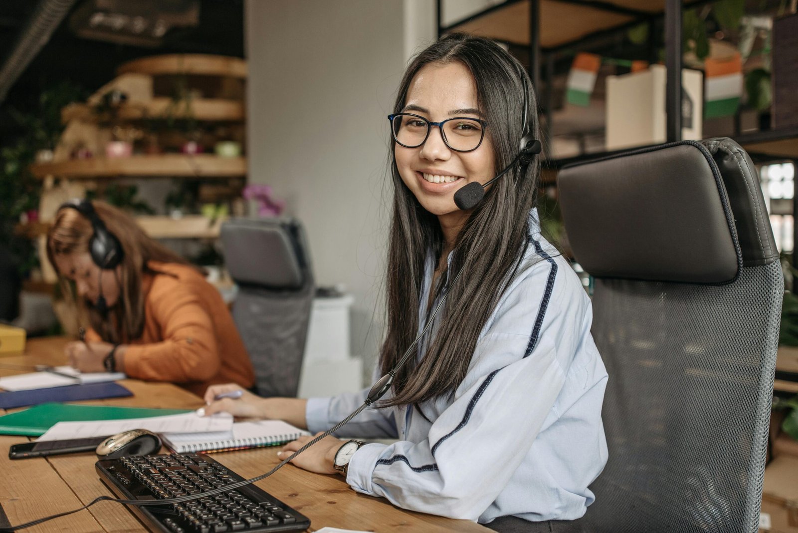 Society Complaint management Customer support representative working in a modern office environment, providing assistance.